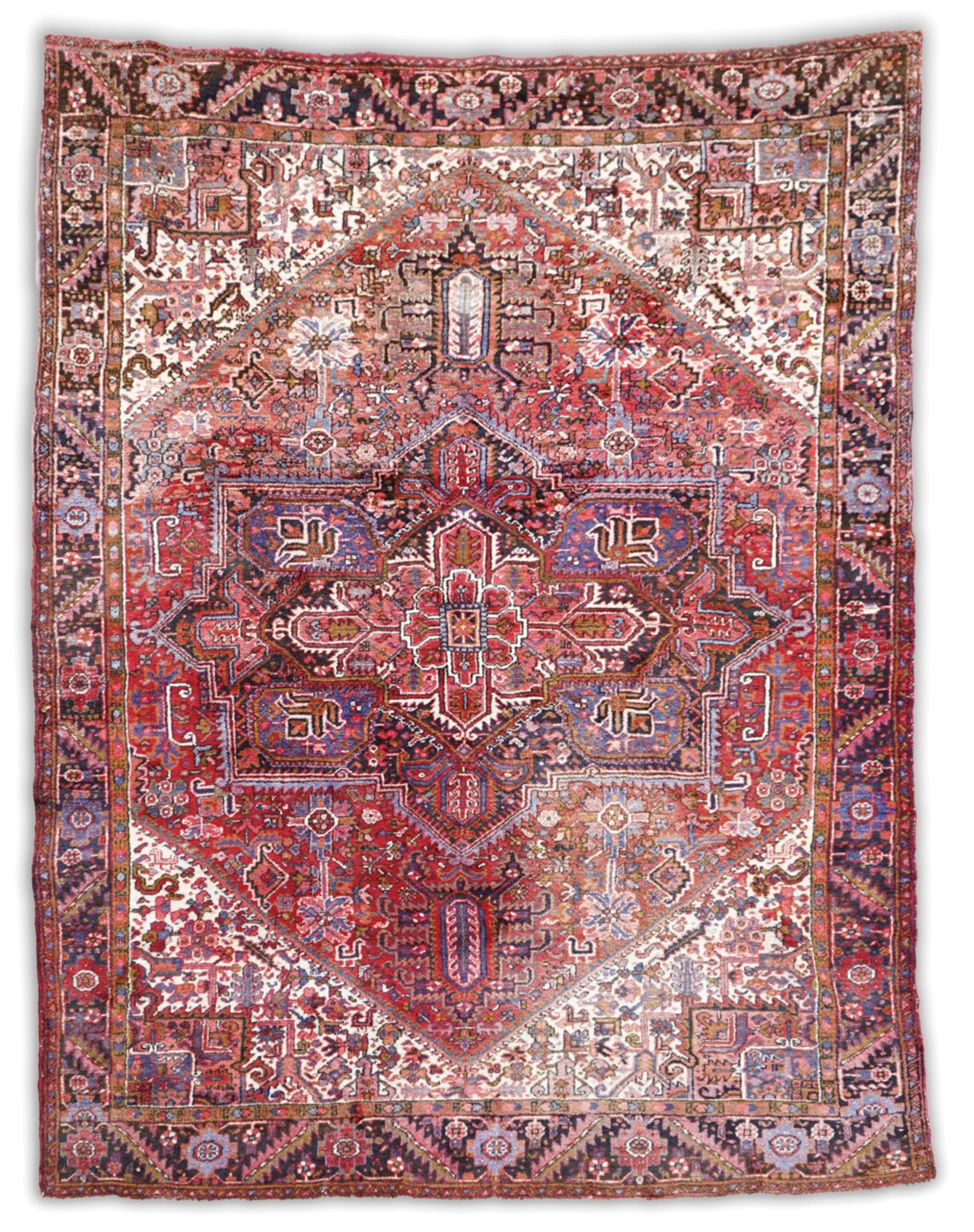 A Heriz brick red ground carpet